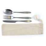 A cutlery set in a calico pouch, including a spoon, fork, and knife. The utensils feature a sleek metallic finish.