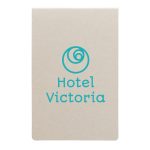 A set of beige sticky notes with a logo and the text "Hotel Victoria" in turquoise.