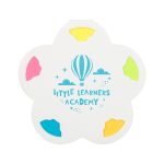 A flower-shaped sticky note holder with blue, pink, yellow, and green notes. Features a logo design.