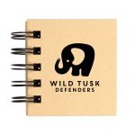 A spiral-bound notebook featuring the logo of "Wild Tusk Defenders," with a graphic of an elephant.