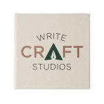 A square note block featuring a beige cover with a logo and text in dark green and brown.