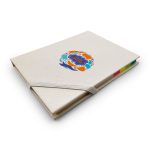 A cream-coloured planner with a colourful logo and a rubber band closure, featuring multicoloured tabs on the side.