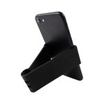 A black Grip Clip Phone Stand holds a smartphone in an upright position, featuring a sleek, minimalist design.