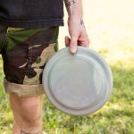 A frisbee made from recycled materials, featuring a smooth, round design in a soft color.