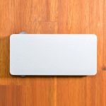 A power bank designed for wireless charging, featuring a sleek and minimalist white exterior.