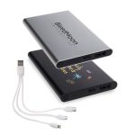 A silver and black power bank with multiple charging ports and a branded logo, accompanied by three charging cables.