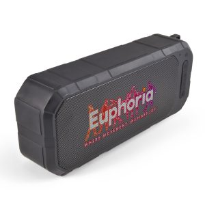 A black, water-resistant speaker with a textured surface and a prominent logo on the front.