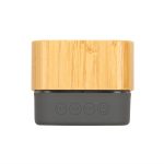 A Bluetooth speaker with a bamboo exterior and a dark gray base featuring control buttons for playback.
