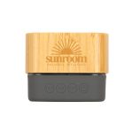 A bamboo Bluetooth speaker with a dark grey base, featuring buttons for playback and a branded logo.