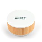 A round speaker and wireless charger in white and bamboo, featuring a logo on the top.