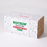A decorative box featuring a playful holiday design with Christmas-themed illustrations in red and green.