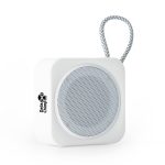 A white compact Bluetooth speaker with a circular mesh grille and a looped cord, featuring a logo.