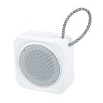 A compact white speaker with a textured black and white handle, featuring a circular grille for sound output.