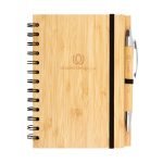 A bamboo notebook with a spiral binding and a matching pen, featuring a logo on the front.