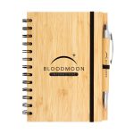 A bamboo notebook featuring a black spiral binding and an elastic band, accompanied by a matching pen.
