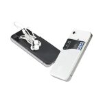 A white and black sticky pouch on two smartphones, each holding a card and earphones. The pouch features a logo.