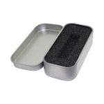 A silver tin box with a removable lid, featuring a black foam interior for pen packaging.