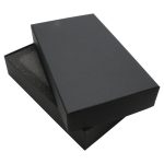 A black two-part gift box with a removable lid and foam interior, designed for packaging items.