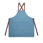 A denim apron in blue with brown leather straps and a large front pocket, featuring a logo.