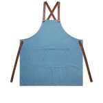 A denim apron in blue with brown straps and a front pocket, featuring a logo.