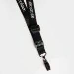 A black lanyard with a clip, featuring a branding label and an adjustable plastic buckle.
